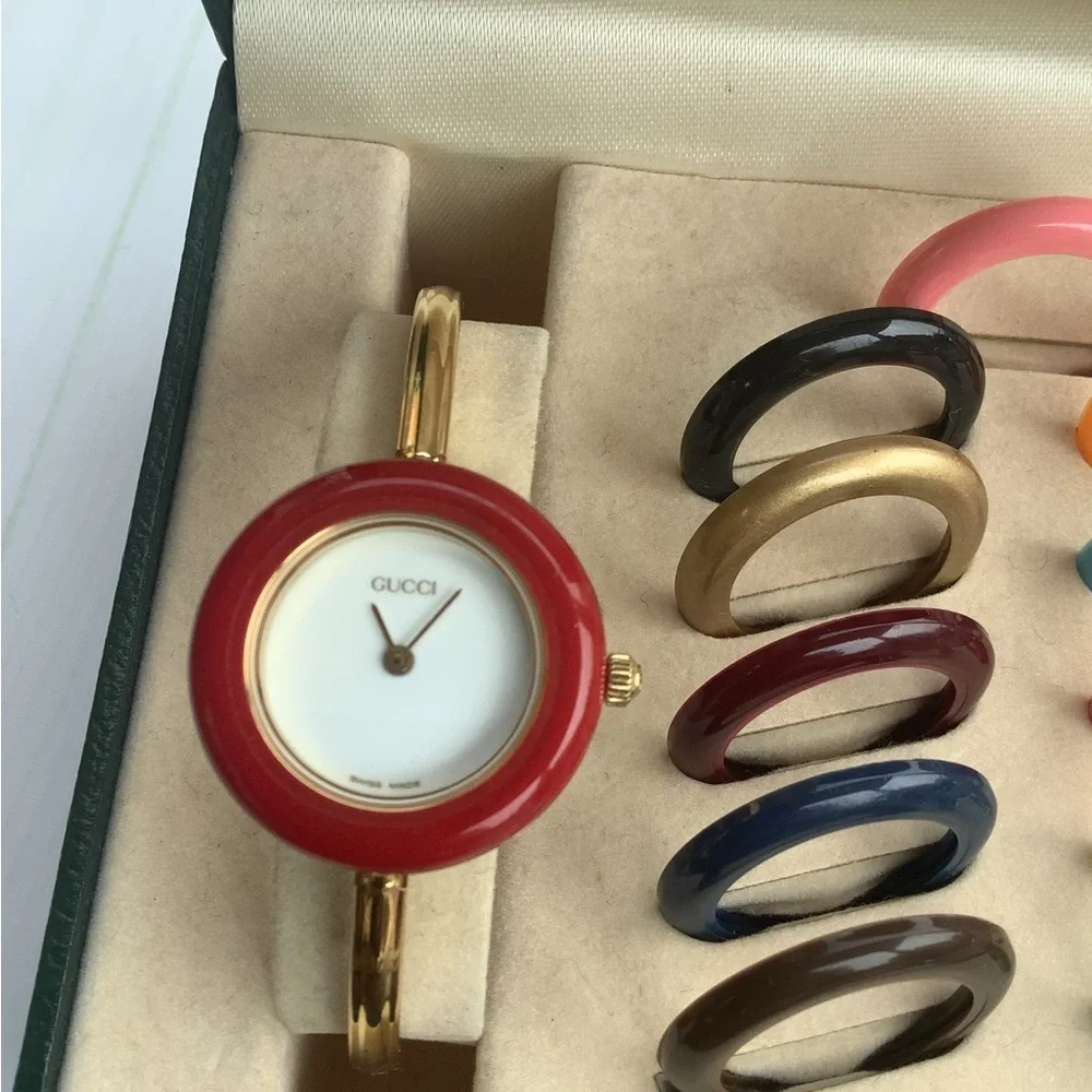 Gucci Women’s Gold Bangle Watch with Interchangeable Color Bezels